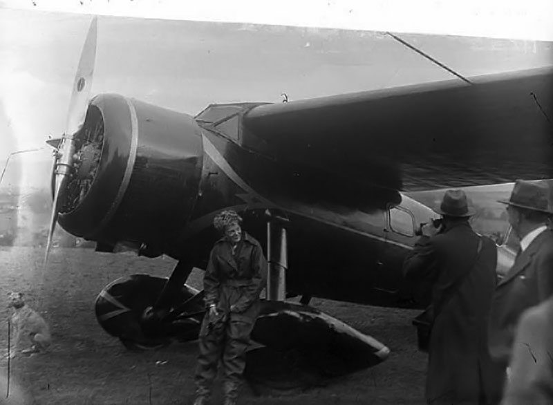 photo of amelia earhart on her plane after landing in derry