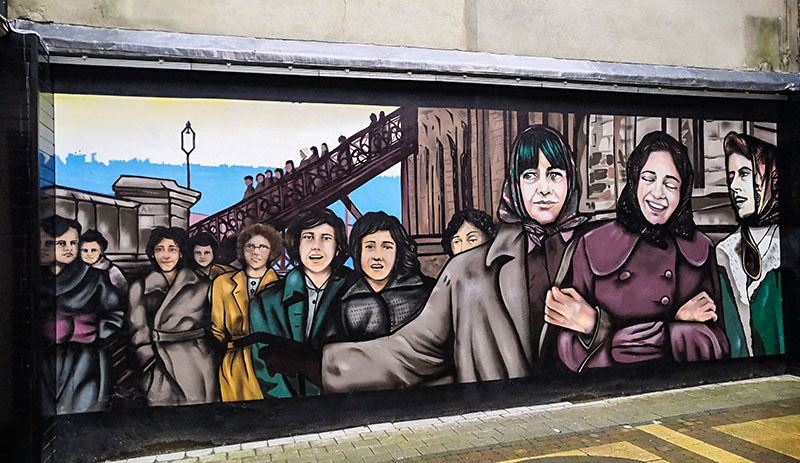 Photo of the factory girls mural in the craft village