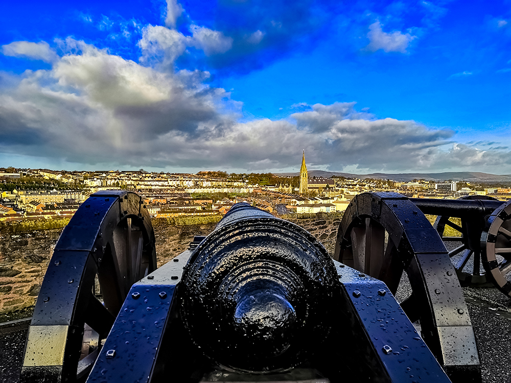 A photo from behind a canon on the derry walls